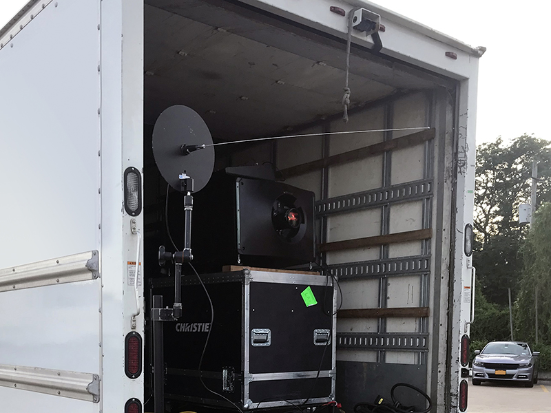 DCI-compliant projection equipment set up for a private outdoor theater in the Bronx, NY.